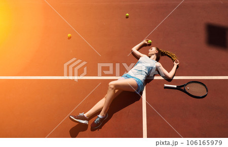 Sexy girl tennis player holding tennis racket on the court. Young woman is playing tennis. 106165979