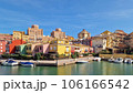 Walk through the streets and canals of the port of Saplaya on a sunny day. Moored yachts and boats at the bright facades of houses. Spain 106166542