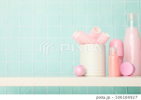 A shelf in the bathroom with care products. A shelf in the bathroom with care products. 106169927