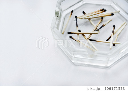 Burnt matches in a glass ashtray. Emotional burnout. Burnt matches in a glass ashtray. Emotional burnout. 106171538