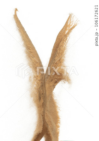 Sand flying explosion, Golden grain wave explode. Abstract cloud fly. Yellow colored sand splash throwing in Air. White background Isolated high speed shutter, throwing freeze stop motion 106172621