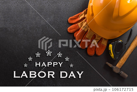 Happy Labor day concept. American flag with different construction tools and the text on dark background. 106172715
