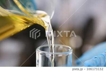 Male hands in protective gloves hold test tube Male hands in protective gloves hold test tube 106173132