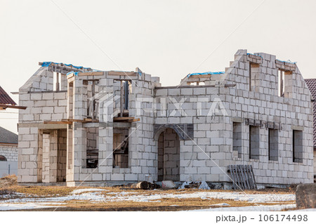 Abandoned unfinished empty house no windows, abandoned construction concept 106174498