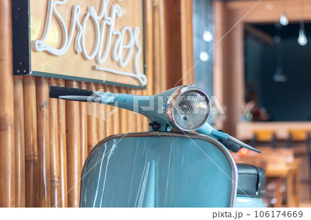 close up Blue vintage scooter in a cafe close up Blue vintage scooter in a cafe 106174669