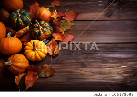 Thanksgiving - themed background with autumn leaves and pumpkins. Generative AI 106178095