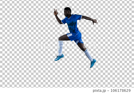 Isolated football player plays with soccerball in a match Isolated football player plays with soccerball in a match 106178629