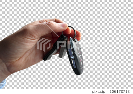 Hand holds a car keys with central locking 106178718