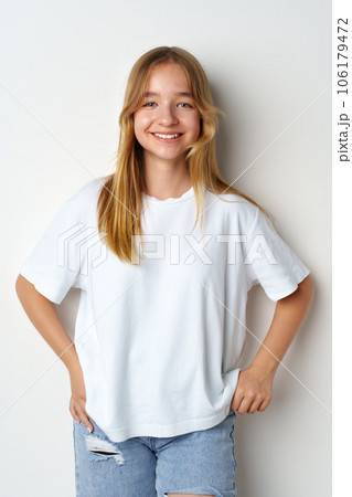 Portrait of young beautiful cute teen girl posing at camera 106179472