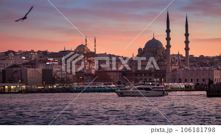15th of March, 2023, Turkey, Istanbul. Ships and boat floating in Bosphorus against mosques and beautiful sunset sky. 15th of March, 2023, Turkey, Istanbul. Ships and boat floating in Bosphorus against mosques and beautiful sunset sky. 106181798
