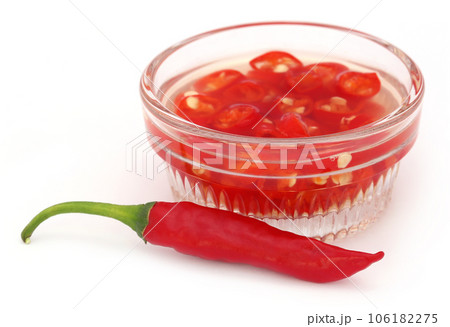 Red chili peppers in a transparent bowl 106182275