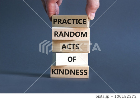 Practice random kind of kindness symbol. Concept words Practice random kind of kindness on wooden block. Beautiful grey background. Businessman hand. Business practice kindness concept. Copy space. Practice random kind of kindness symbol. Concept words Practice random kind of kindness on wooden block. Beautiful grey background. Businessman hand. Business practice kindness concept. Copy space. 106182575