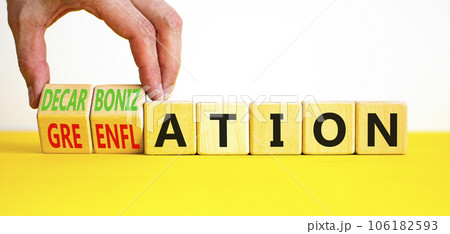Decarbonization or greenflation symbol. Concept words Decarbonization Greenflation on cubes. Beautiful white background. Businessman hand. Business decarbonization greenflation concept. Copy space. Decarbonization or greenflation symbol. Concept words Decarbonization Greenflation on cubes. Beautiful white background. Businessman hand. Business decarbonization greenflation concept. Copy space. 106182593
