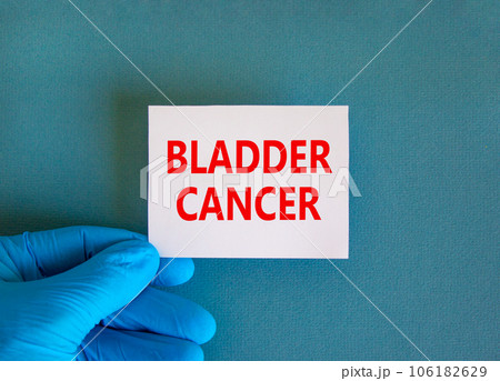 Bladder cancer symbol. White note with words Bladder cancer, beautiful blue background, doctor hand in blue glove. Medical and bladder cancer concept. 106182629