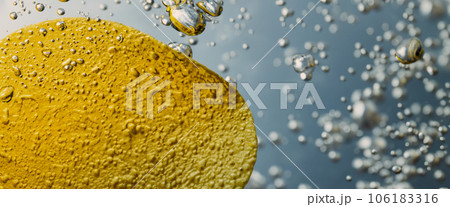 Deep fried potato chips under golden oil water. Frying rounded potatoes chip with hot boiling oil bubbles. Fast food and snack. Underwater cooking oily french fries or potatos chips in oils background 106183316