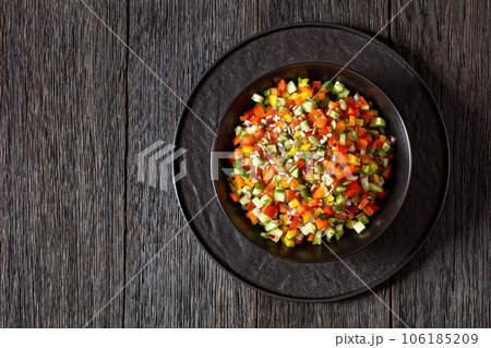 Israeli salad of finely diced veggies in bowl 106185209
