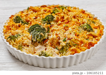 chicken rice broccoli casserole in baking dish 106185211