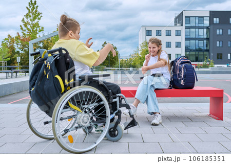 Friendship communication of children of boy in wheelchair and girl 106185351