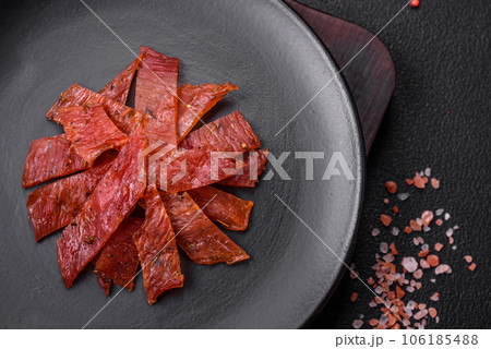 Delicious dried veal or turkey jerky with salt, spices and herbs Delicious dried veal or turkey jerky with salt, spices and herbs 106185488