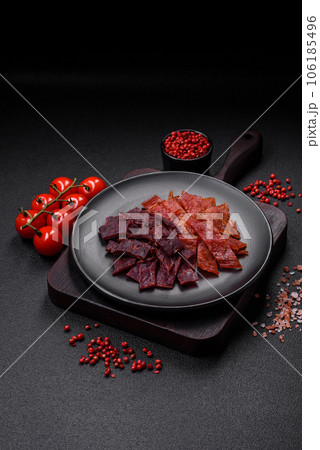 Delicious dried veal or turkey jerky with salt, spices and herbs 106185496