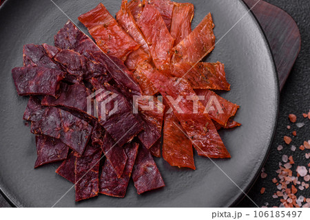 Delicious dried veal or turkey jerky with salt, spices and herbs 106185497