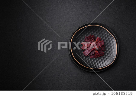 Delicious dried veal or turkey jerky with salt, spices and herbs 106185519