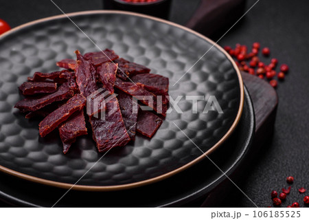 Delicious dried veal or turkey jerky with salt, spices and herbs Delicious dried veal or turkey jerky with salt, spices and herbs 106185525