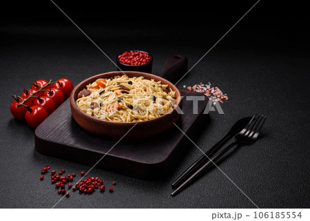 Delicious Uzbek pilaf with chicken, carrots, barberry, spices and herbs 106185554