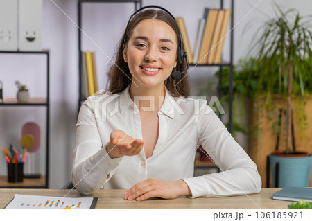 Businesswoman working on laptop wearing headset call center support service operator office helpline Businesswoman working on laptop wearing headset call center support service operator office helpline 106185921