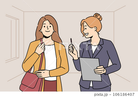 Woman real estate agent or realtor shows apartment to girl to client and offers conclude contract. 106186407