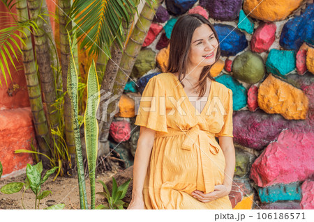 A strong and resilient woman over 40 embraces the beauty of childbirth in Mexico, celebrating the journey of motherhood with cultural richness A strong and resilient woman over 40 embraces the beauty of childbirth in Mexico, celebrating the journey of motherhood with cultural richness 106186571