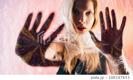Future prediction. Nft art. Palmistry fortune. Confident oracle woman face colorful glitch noise hand palms on peach pink glow background. Future prediction. Nft art. Palmistry fortune. Confident oracle woman face colorful glitch noise hand palms on peach pink glow background. 106187653