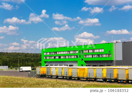 Distribution warehouse with trucks of different capacity. 106188352