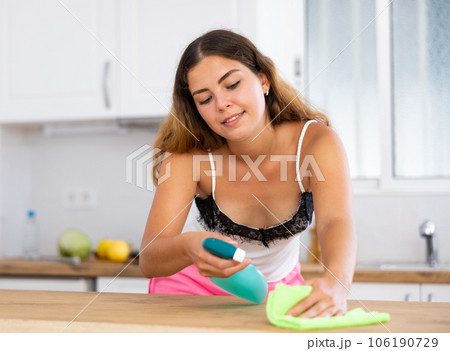 Woman housewife cleaning furniture at home kitchen Woman housewife cleaning furniture at home kitchen 106190729