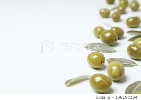 Olives and leaves on white background, space for text Olives and leaves on white background, space for text 106197304