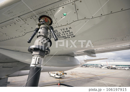 Close-up refueling of airplane at airport. 106197915