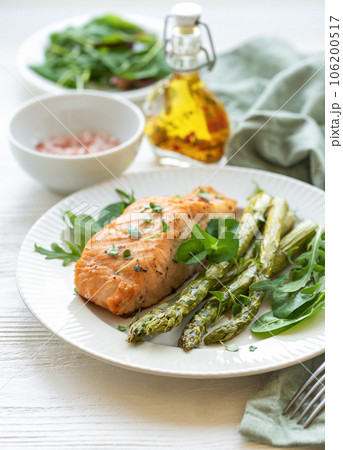 Baked Delicious salmon, green asparagus on plate Baked Delicious salmon, green asparagus on plate 106200517