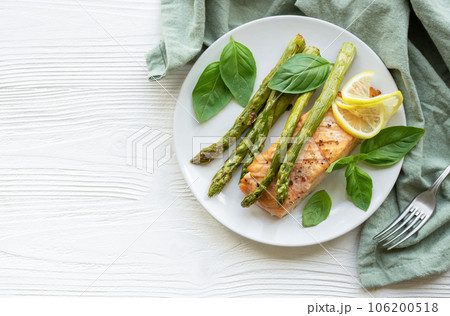 Baked Delicious salmon, green asparagus on  plate Baked Delicious salmon, green asparagus on  plate 106200518