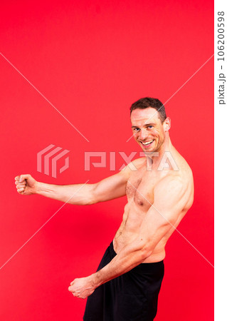 Man athlete isolated on black, red, white background. Fitness motivation. Man athlete isolated on black, red, white background. Fitness motivation. 106200598