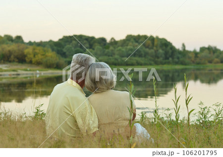 Senior couple hugging in the park, back view Senior couple hugging in the park, back view 106201795
