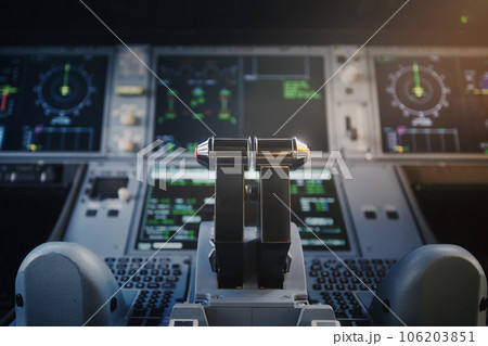 Engine thrust levers in cockpit of modern airplane. 106203851