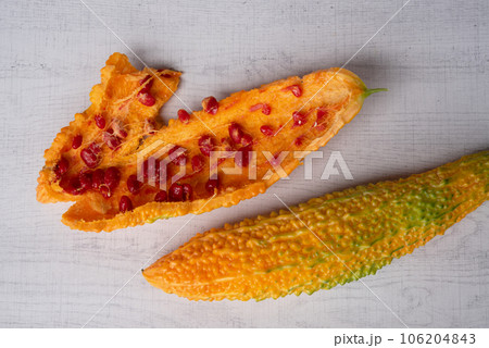 Bitter melon or bitter gourd (yellow) ready for seeds extraction. Bitter melon or bitter gourd (yellow) ready for seeds extraction. 106204843