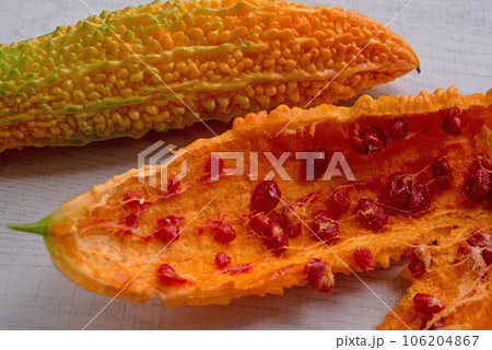 Bitter melon or bitter gourd (yellow) ready for seeds extraction. Bitter melon or bitter gourd (yellow) ready for seeds extraction. 106204867