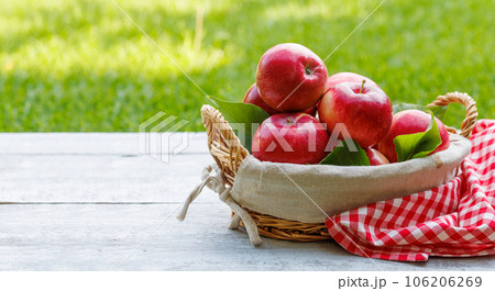 Basket with fresh red apples Basket with fresh red apples 106206269