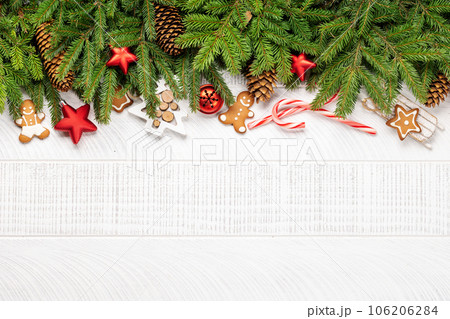 Christmas fir tree branch with decor and space Christmas fir tree branch with decor and space 106206284