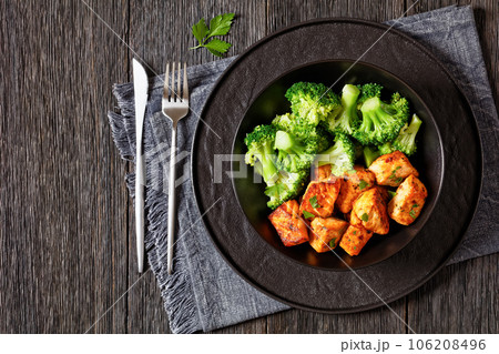 baked salmon bites with steamed broccoli florets baked salmon bites with steamed broccoli florets 106208496