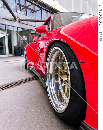 Fragment of a Red sport car, wheel BBS disk Close up Fragment of a Red sport car, wheel BBS disk Close up 106208815