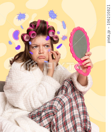 Contemporary art collage. Upset young girl in hair-curlers sitting and looking at mirror examining skin. Background with harmful bright bacteria. 106210821