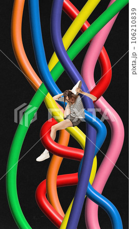 Contemporary art collage. Young flexible woman between colorful gradient rainbow confused lines isolated dark mode background. Contemporary art collage. Young flexible woman between colorful gradient rainbow confused lines isolated dark mode background. 106210839