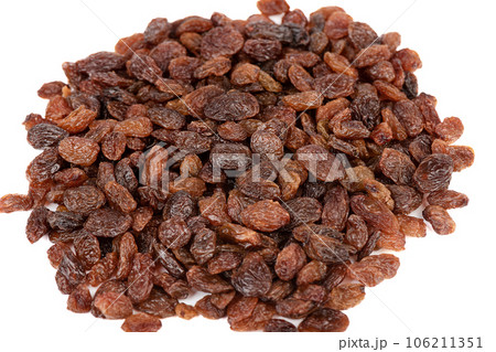 Top view of a pile of sweet raisins on a white background. Top view of a pile of sweet raisins on a white background. 106211351